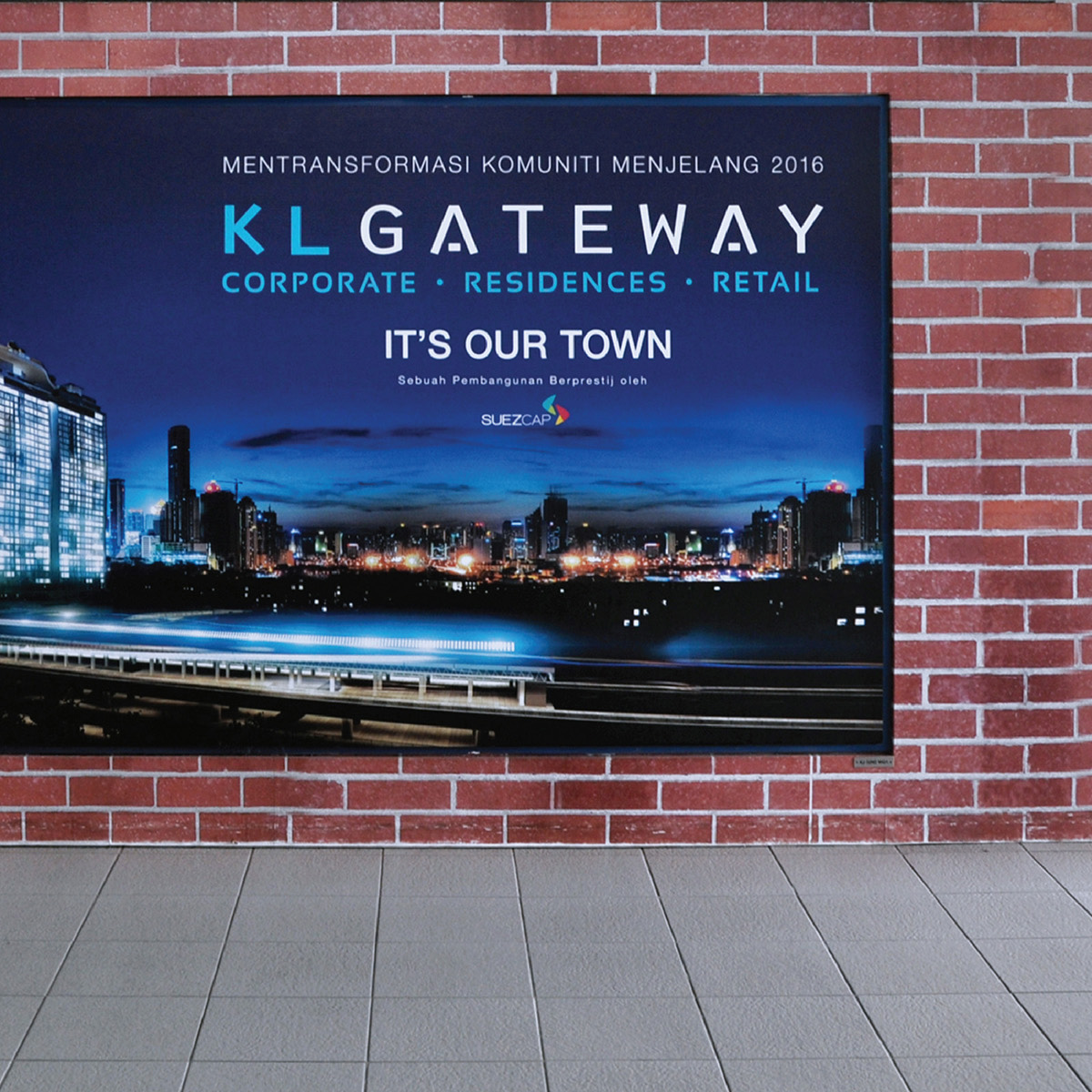 KL Gateway brand advertisement design in the train station display board showing new development facade at night with tagline